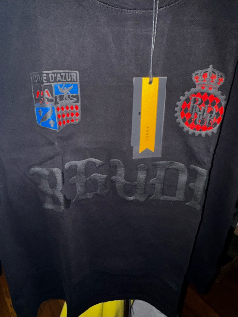 Rhude Black short Sleeve Crest Graphic Shirt with Red & Blue puff print Accents.
